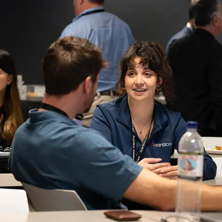 A picture of Avantiico employees discussing Dynamics 365 support services.